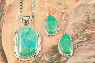 Genuine Crow Springs Turquoise set in Sterling Silver. Beautiful Pendant and Earring Set. Created by Navajo Artists Margaret Platero and Lucy Valencia. Signed by the artists. The Crow Springs Mine is located near Tonopah, Nevada. Free 18